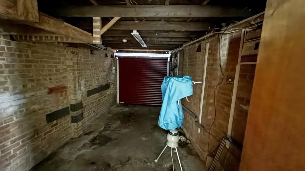 Lot: 29 - SEMI-DETACHED BUNGALOW IN NEED OF REFURBISHMENT - Internal image of garage from inside